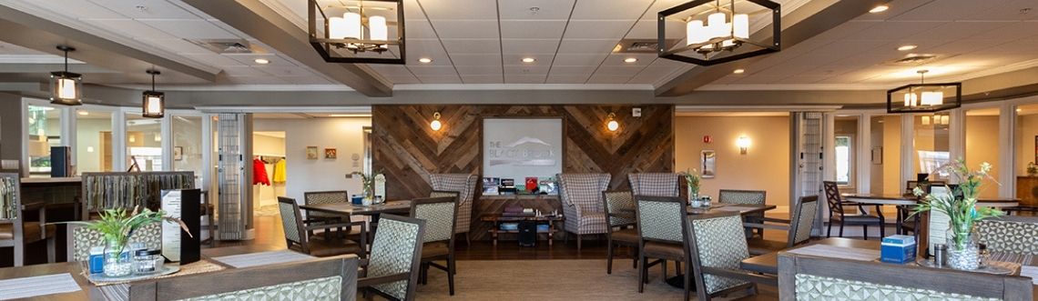 Covenant Living of Keene's dining room with set tables and decor