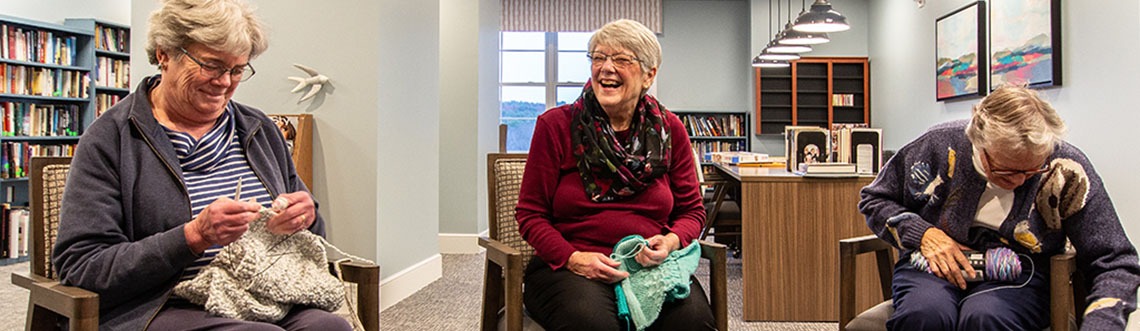 the women happily knitting