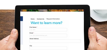 Person holding tablet with Covenant's reqeust information form