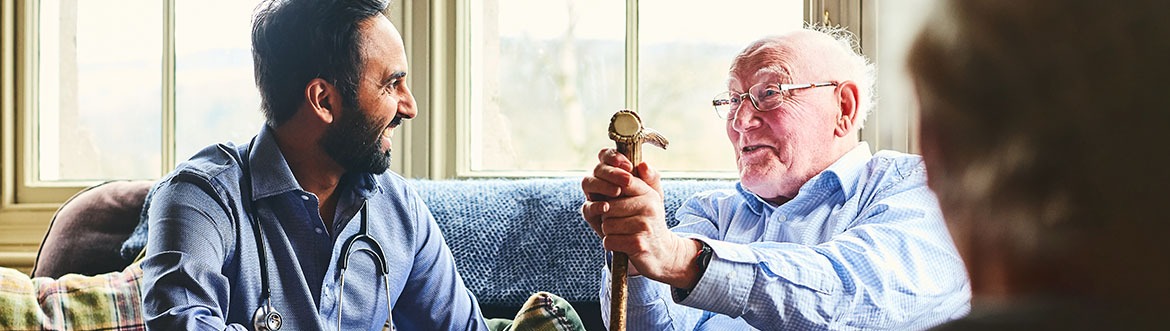 Doctor and patient smiling sitting down together